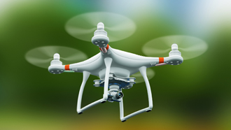 Drone branco num fundo verde.